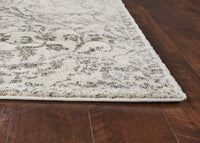 8'x10' Ivory Machine Woven Distressed Floral Vines Indoor Area Rug