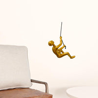 6" x 3" x 3" Resin Gold Climbing Man