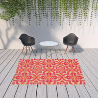 6' x 9' Pink and Orange Medallion Indoor Outdoor Area Rug