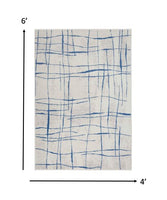 4? x 6? Ivory and Blue Irregular Grids Area Rug