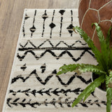 7? x 9? Ivory and Black Eclectic Patterns Indoor Area Rug