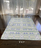 5' X 7' Light Green And Beige Oriental Area Rug