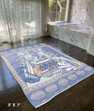 5' X 7' Blue And Orange Oriental Area Rug