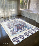 5' X 7' Brown And Muted Blue Abstract Area Rug