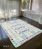 5' X 7' Beige And Green Oriental Area Rug