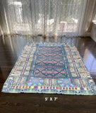 5' X 7' Red And Green Oriental Area Rug